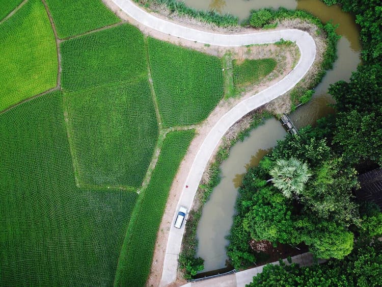 Aerial view of a road with sharp curve