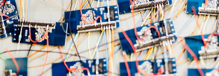 Many chips waiting to be soldered onto a board, representing mass production