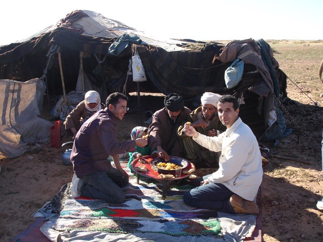 Bedouins eating in front of their tent